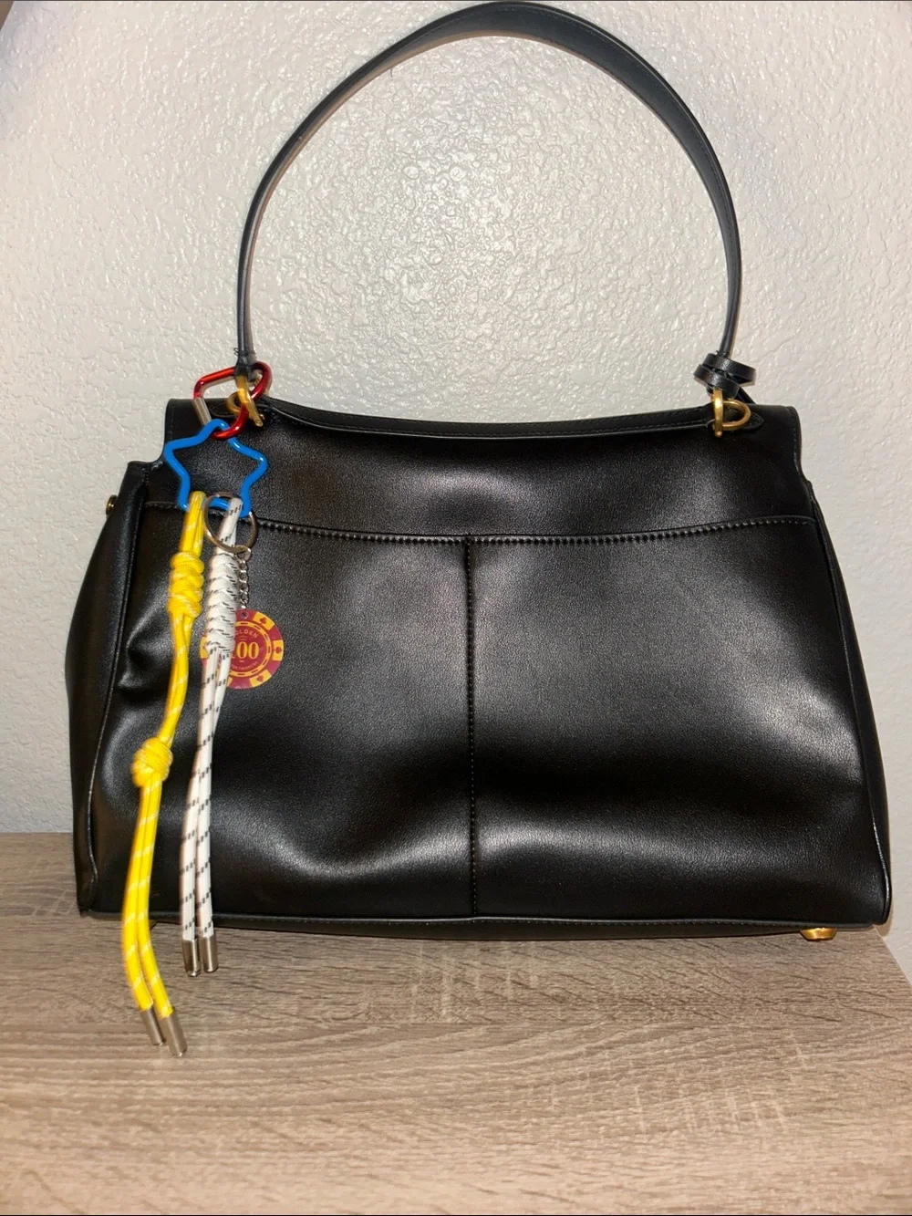 Black Leather Top-Handle Bag with Gold Hardware, keychain and lucky charm